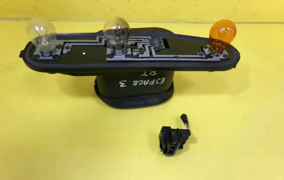Tail light bulb cover holder