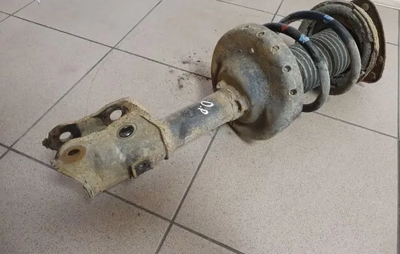Front shock absorber with coil spring