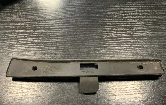 Front door check strap stopper