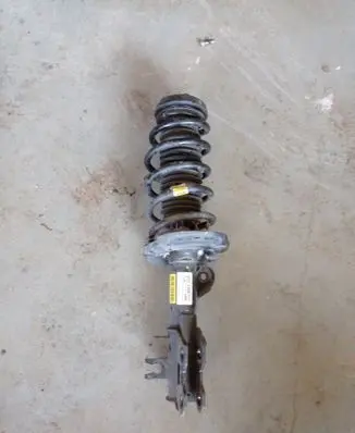 Buick Encore I Front shock absorber with coil spring 95266854 2369 B22897