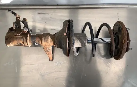 Honda FR-V Front shock absorber with coil spring 