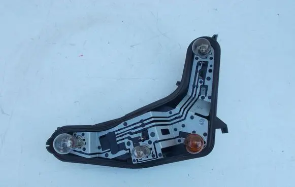 Tail light bulb cover holder