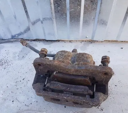 Subaru Forester SF Front brake caliper