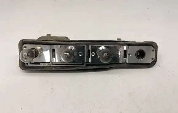 Tail light bulb cover holder
