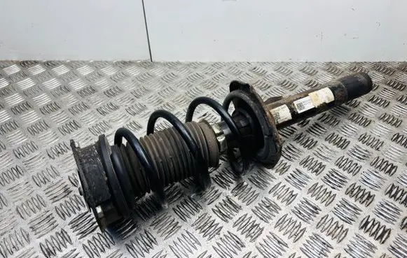Volkswagen Golf VII Front shock absorber with coil spring 5Q0413023FJ