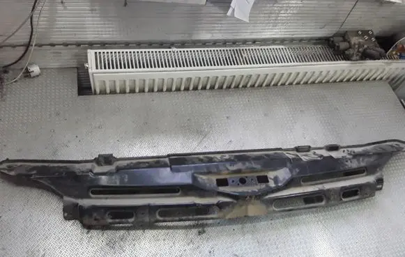 Top upper radiator support slam panel