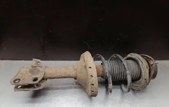 Subaru Impreza II Front shock absorber with coil spring
