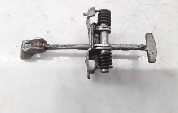 Front door check strap stopper