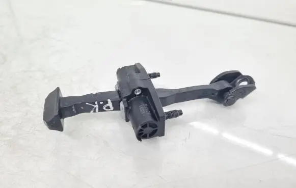 Front door check strap stopper