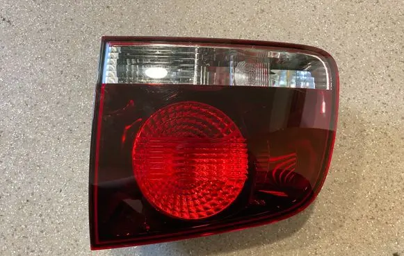 Volkswagen Touareg I Tailgate rear/tail lights 7L6945094T