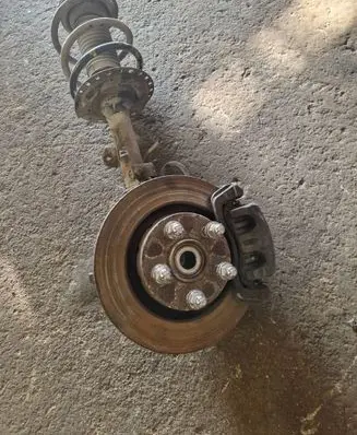 Front wheel hub spindle knuckle
