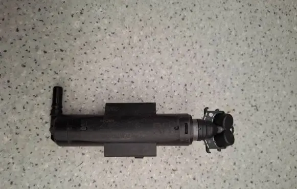 Ford Kuga II Headlight washer spray nozzle GV4113L014AE