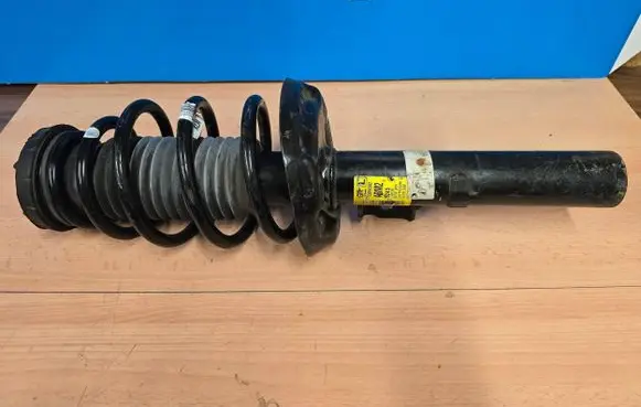 Opel Astra J Front shock absorber with coil spring 13390302 522953660