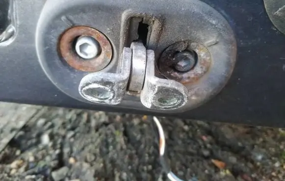 Front door check strap stopper