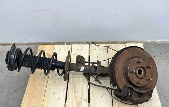 Nissan Juke I F15 Front shock absorber with coil spring 