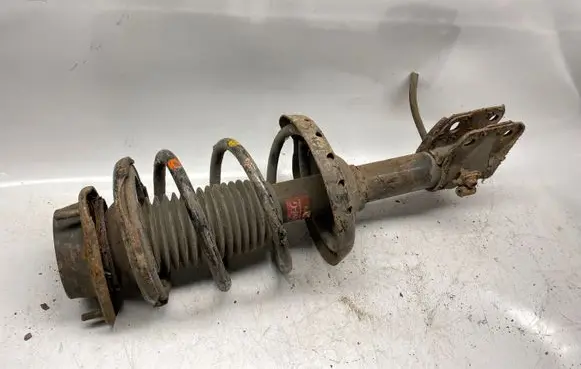 Subaru Impreza II Front shock absorber with coil spring