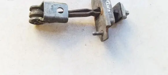 Front door check strap stopper