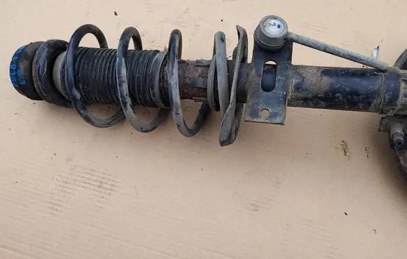 Front shock absorber with coil spring