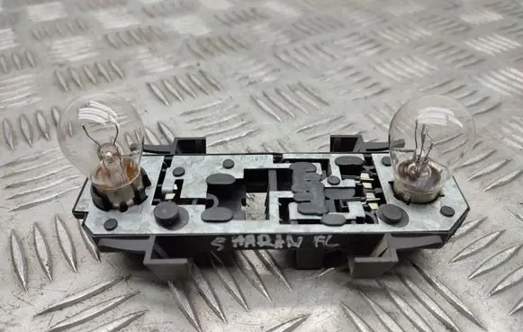 Tail light bulb cover holder
