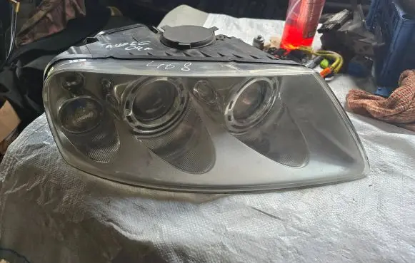 Volkswagen Touareg I Headlight/headlamp 7L6941016BK