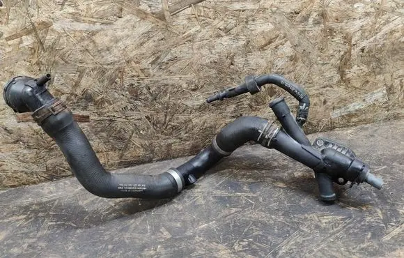 Volkswagen Caddy Engine coolant pipe/hose 03L121131AA 1K0122101KN