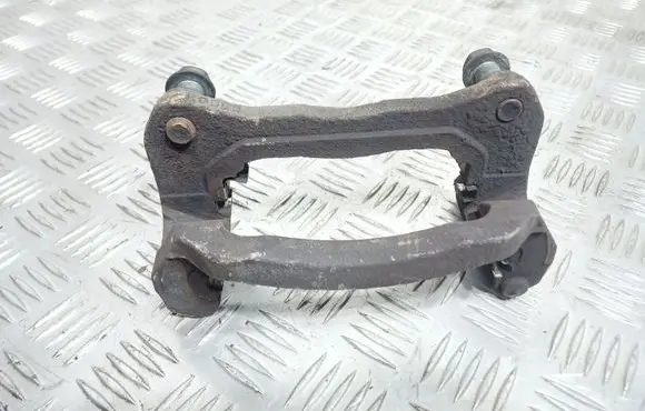 Mazda CX-7 Front Brake Caliper Pad/Carrier 