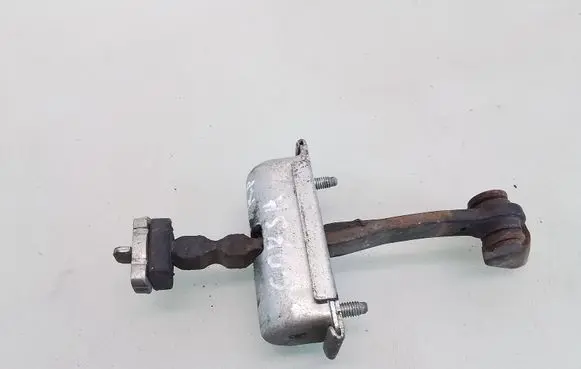 Front door check strap stopper