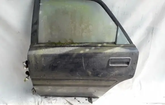 Mazda 323 Rear door PILKA