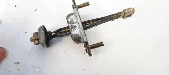 Mazda 323 F Front door check strap stopper 
