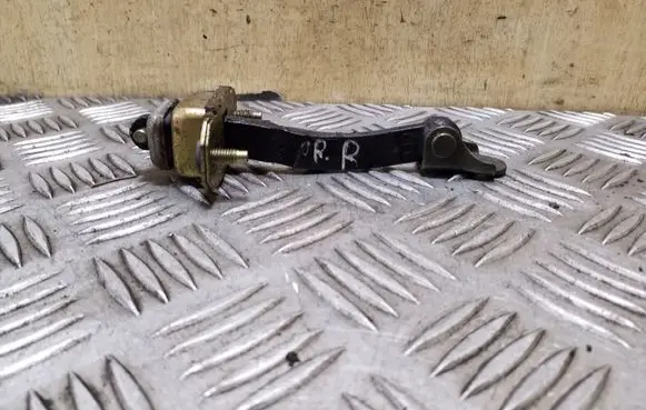 Subaru Legacy Front door check strap stopper
