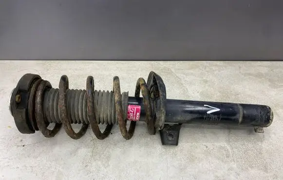 Volkswagen PASSAT B6 Front shock absorber with coil spring 335808
