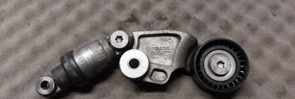 Mazda 3 III Generator/alternator belt tensioner SH0115980