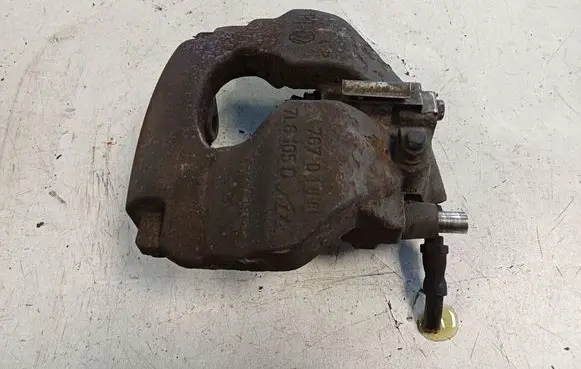 Volkswagen Touareg I Front brake caliper 
