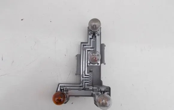 Tail light bulb cover holder