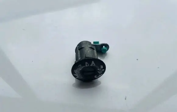 Mazda 323 Front door lock (next to the handle) 