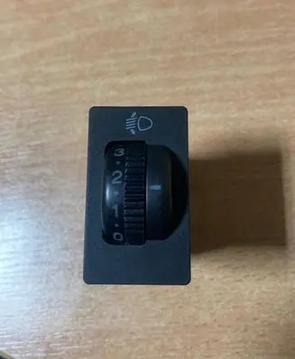 Headlight level height control switch