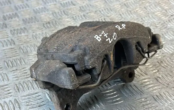 Volkswagen PASSAT B7 Front brake caliper