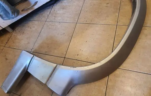 Suzuki Grand Vitara I Front arch trim 7765065DA