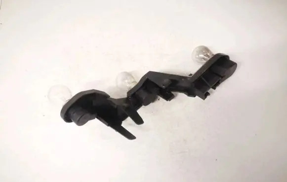 Tail light bulb cover holder