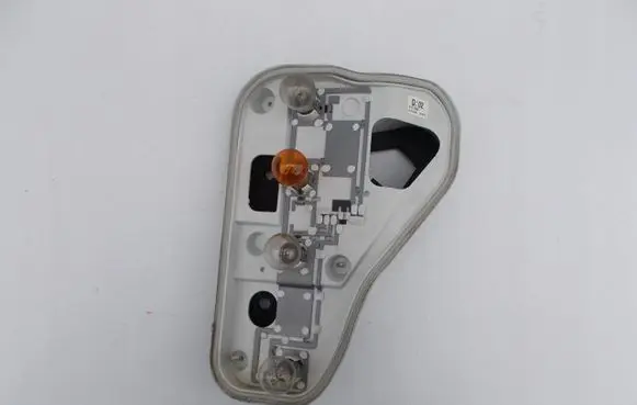 Tail light bulb cover holder