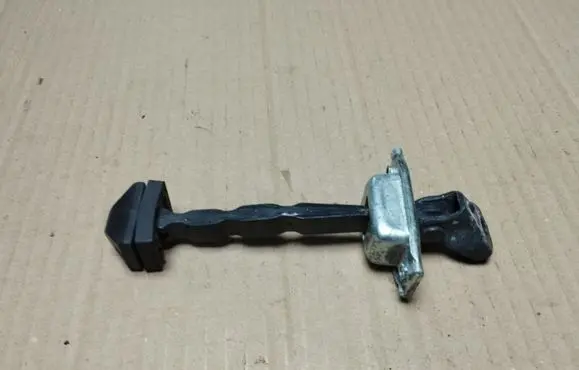 Front door check strap stopper