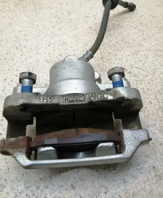 Dacia Spring Front brake caliper 410009315R