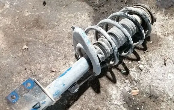 Peugeot Partner Front shock absorber with coil spring