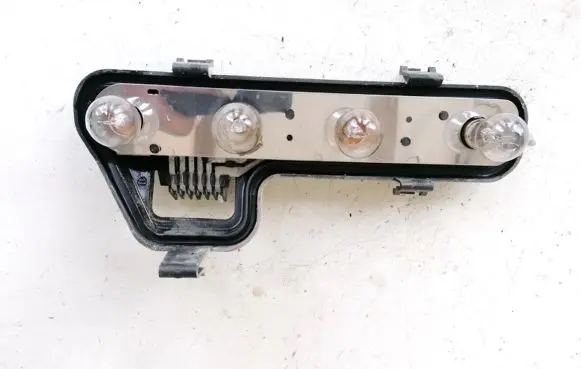 Tail light bulb cover holder