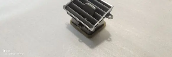 Dash center air vent grill