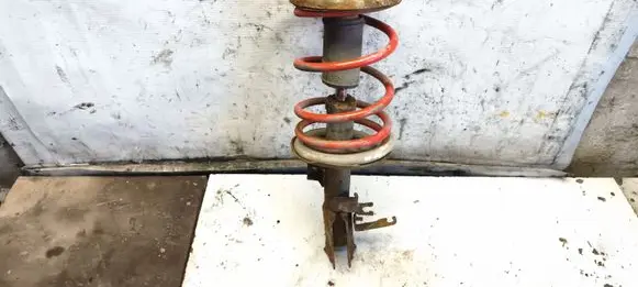 Mitsubishi Lancer X Front shock absorber with coil spring 
