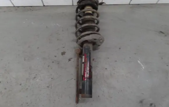 Volkswagen Caddy Front shock absorber with coil spring