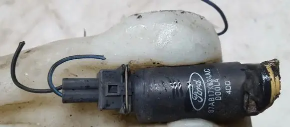 Mazda 626 Windscreen/windshield washer pump 87AB17K624AC