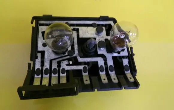 Tail light bulb cover holder