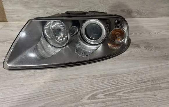 Volkswagen Touareg I Headlight/headlamp 7L6941015